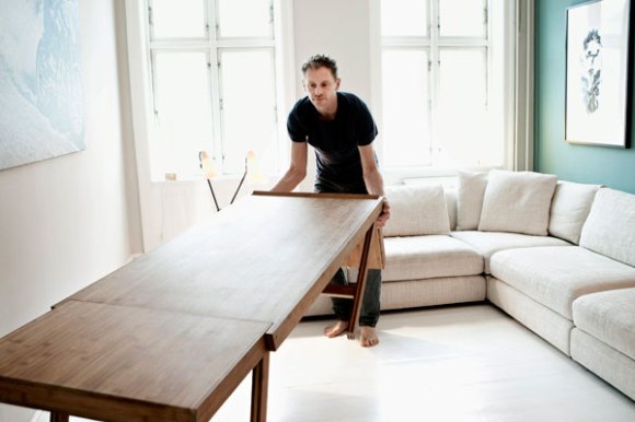 The adjustable table may be used as both dining- and livingroom table.